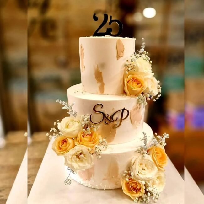 golden-peach-monogram-milestone-cake