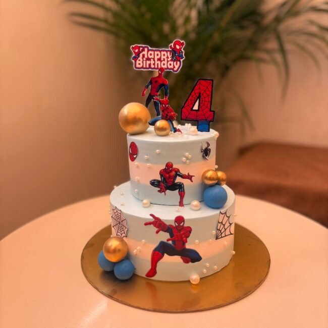 light-blue-superhero-cake-with-spider-man-cutouts